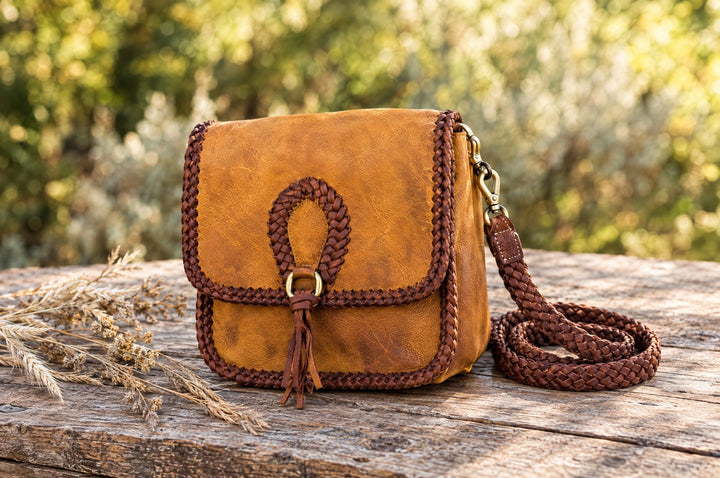Fall Adventure saddle bag on a wood table outdoors