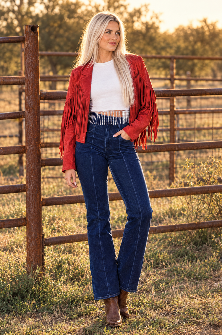White rhinestone crop top styled with Double Down fringe jacket and After Dark jeans
