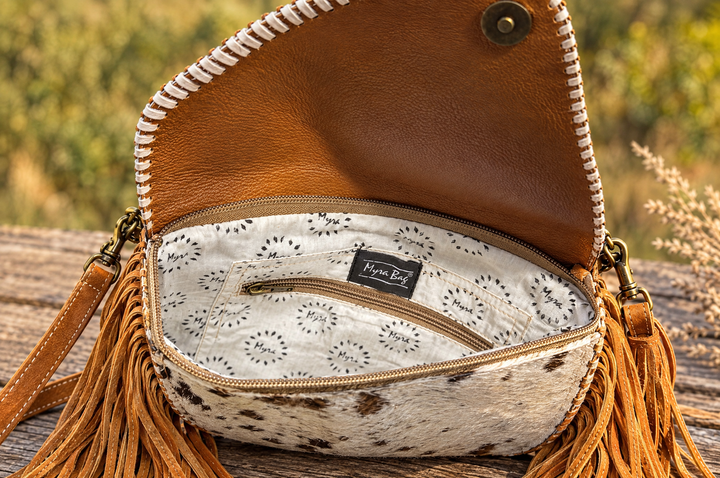 Inside of the Moonlit Ranch crossbody showing lining and zip pocket