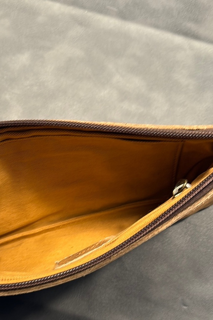 Inside of the Always Clutch wristlet in camel