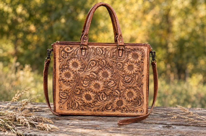 Moment Of Tomorrow tooled bag on a wood table outdoors