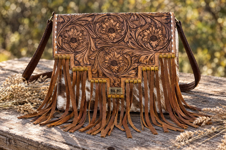 Rodeo Rose crossbody on a wood table outdoors