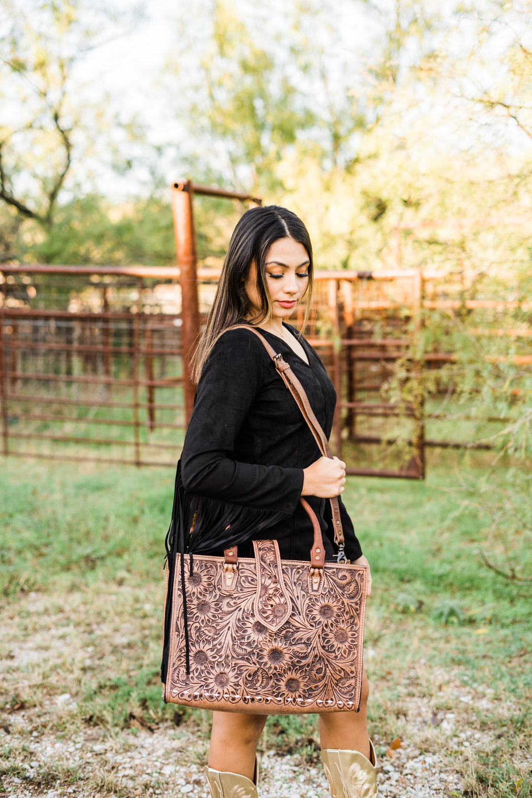 Sunflower tooled leather tote styled with a black fringe dress