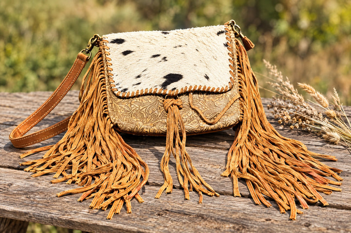 Wild Honey crossbody on a wood table outdoors